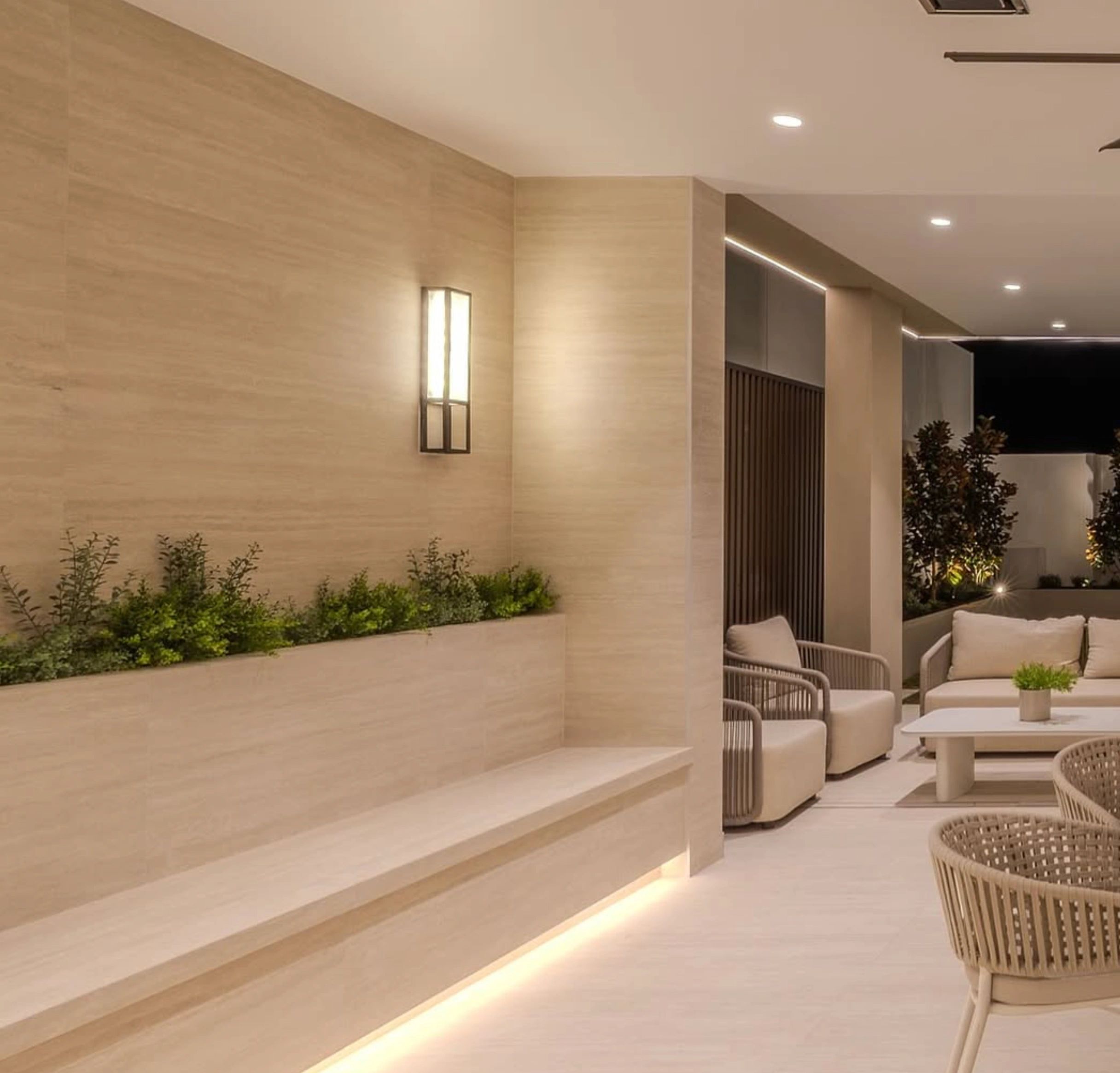 Contemporary lounge beige stone walls built-in planters